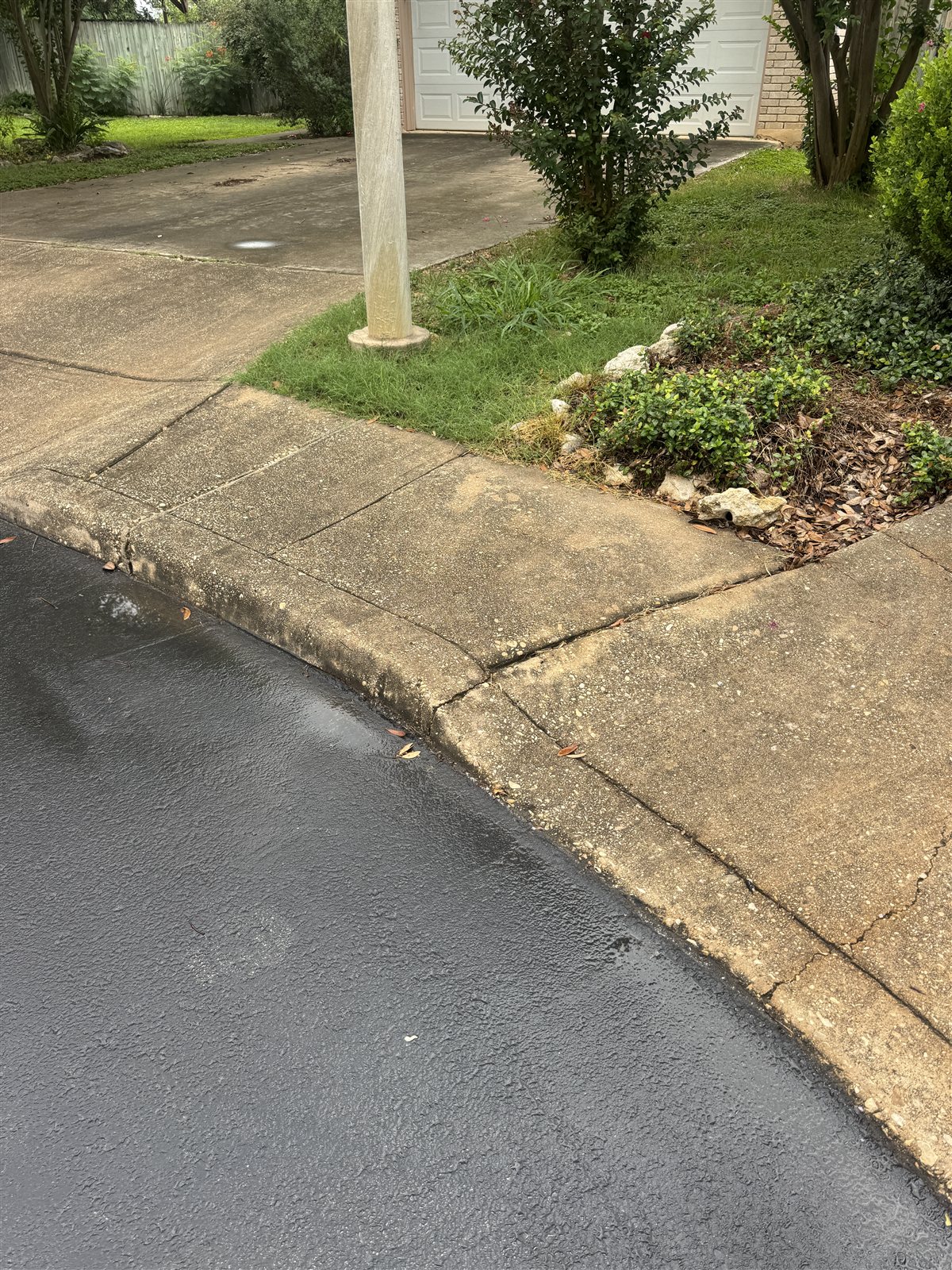 Concrete Curb & Approach before pressure washing in San Antonio